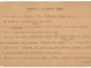 A worn postcard from the Imperial Japanese Army with typed statements and underlined options for a prisoner to report their condition; handwritten responses indicate the person is uninjured and hoping to be with family soon.
