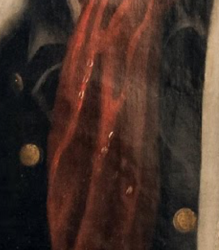 A detail of Smith’s red bandanoe handkerchief showing the telltale white squares indicative of the Indian textile.