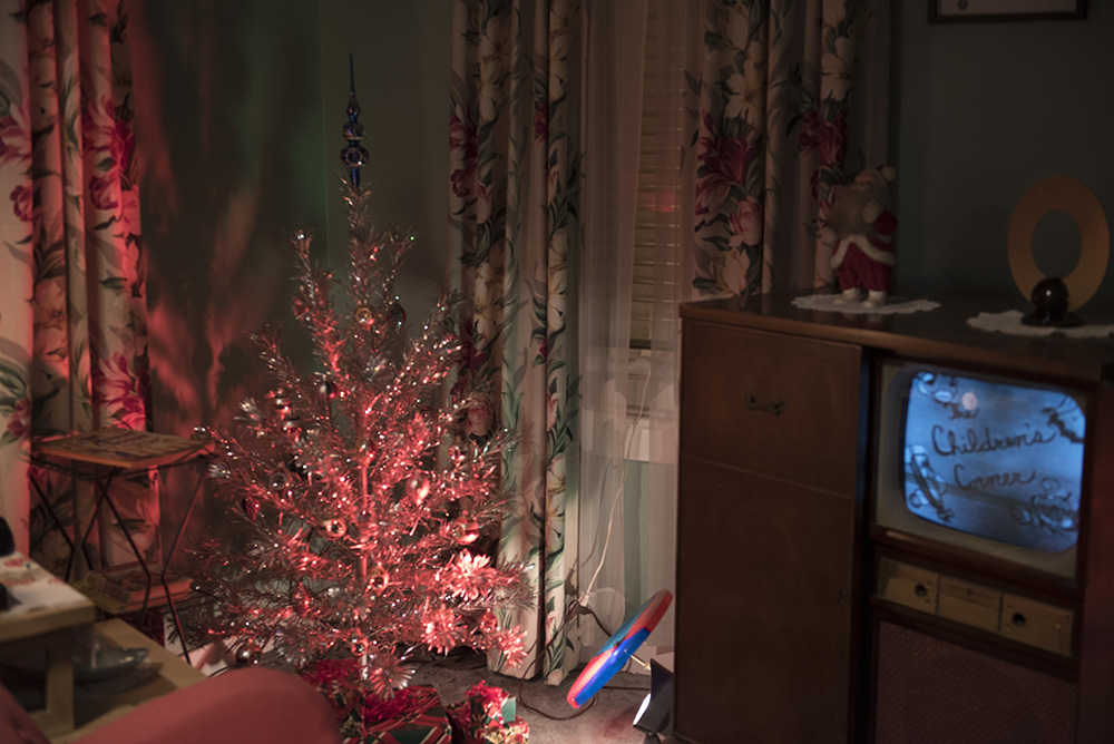 1950s suburban house all decked out for Christmas, including an aluminum Christmas tree, in the Pittsburgh: A Tradition of Innovation exhibit.