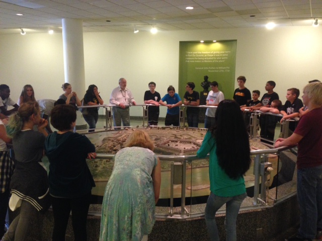 Jack Sheehan, History Center and Fort Pitt Museum docent, showing a school tour the Fort Pitt diorama. 