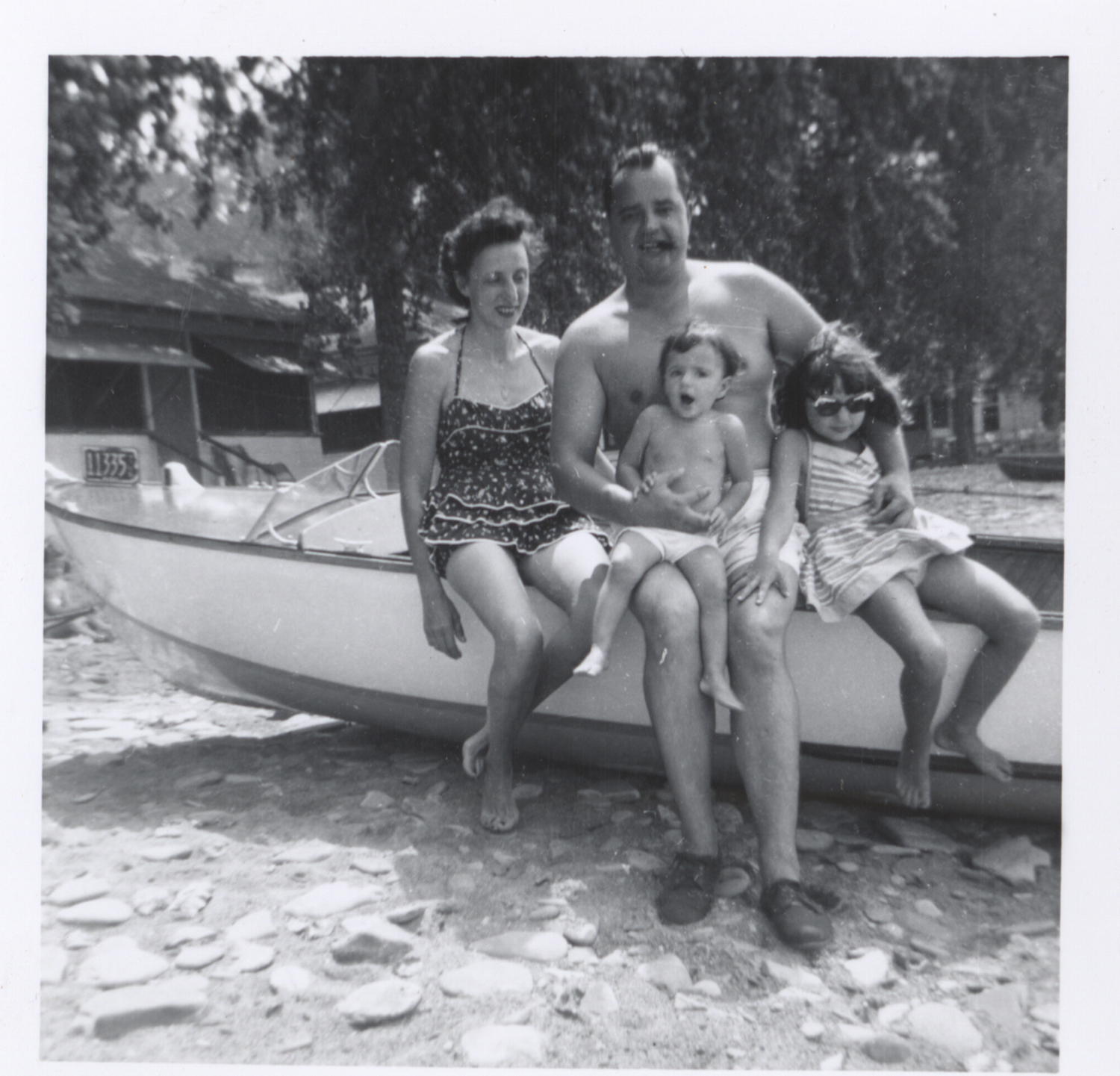 Ray and Louise Kins gather the kids for a picture with the boat, 1950s. Kins Family collection, MSS 20, Detre Library & Archives, Heinz History Center.