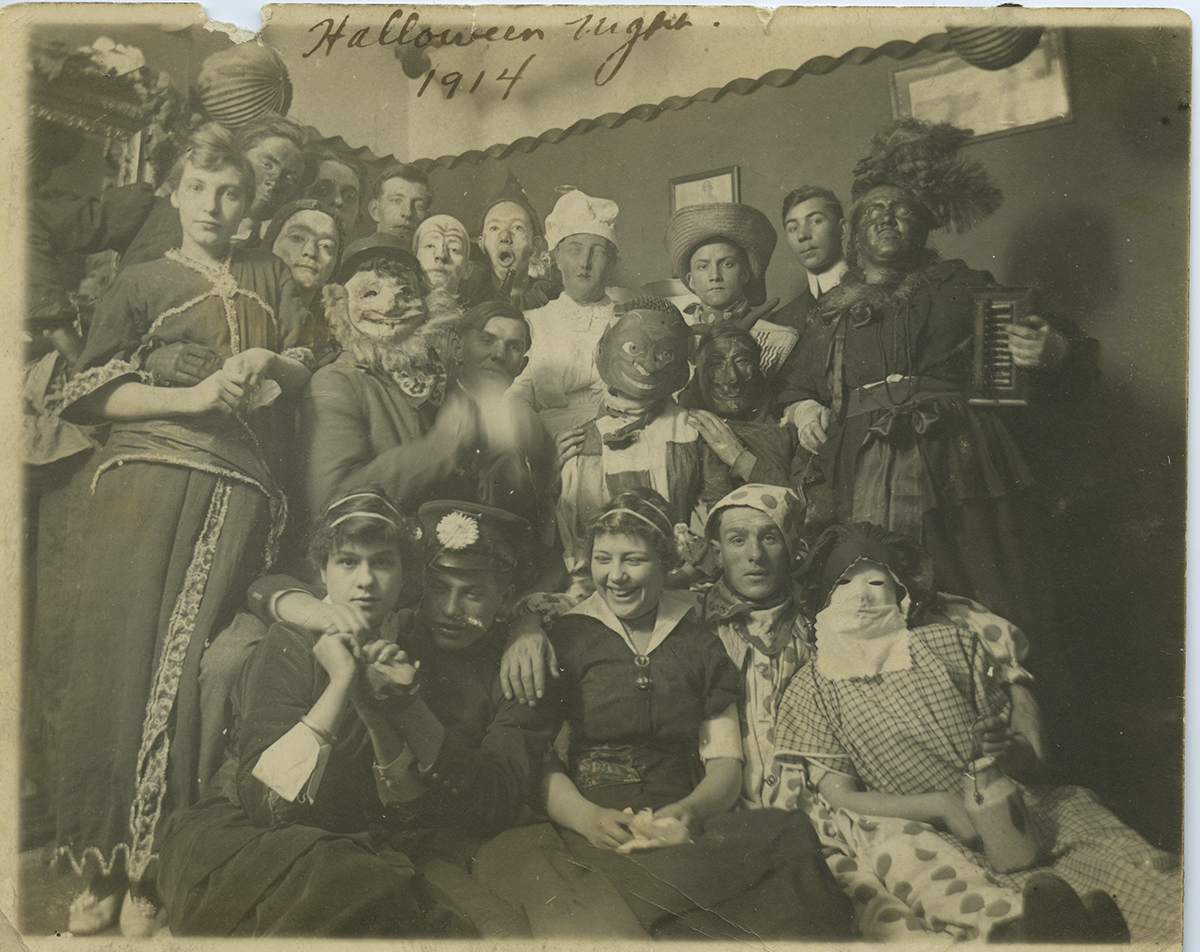 A festive group gathers for a Halloween Party in Millvale, 1914. Reiber-Sachs Collection, Detre Library & Archives at the Heinz History Center.