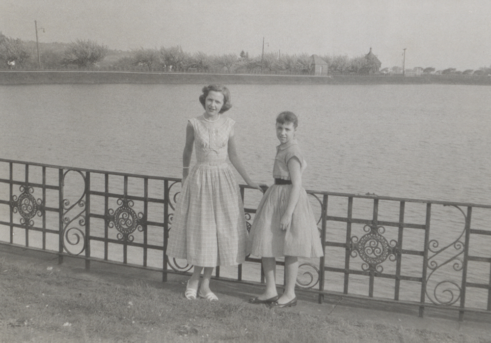 Sisters Barbara and Diane pose at the Highland Park reservoir, 1956. Taylor Family Collection, Detre Library & Archives at the History Center.