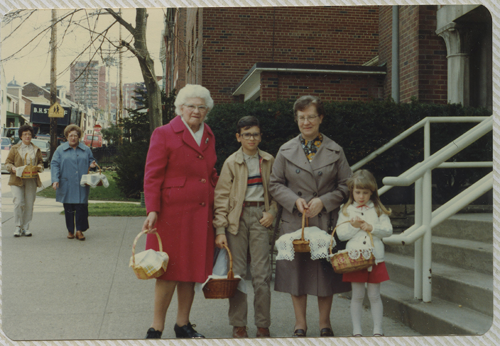 Group outside the Holy Family church in Lawrenceville for the Polish tradition of Święconka - the blessing of Easter foods on Holy Saturday. Heinz History Center.