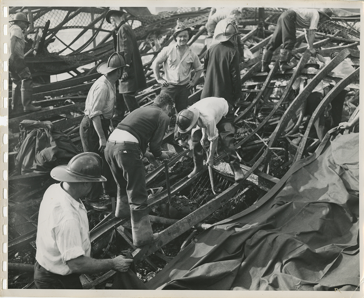 Investigators search through the collapsed steel remains of the Island Queen’s five decks, 1947. | Heinz History Center