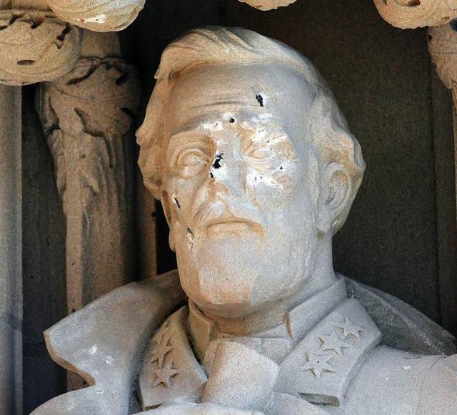 The Robert E. Lee statue at Duke University was defaced before being removed from its chapel niche.