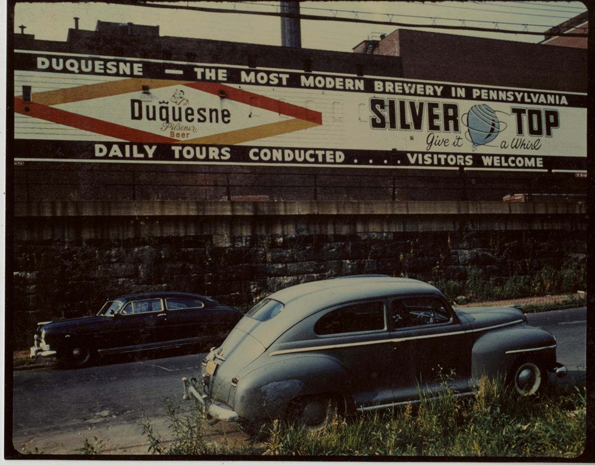 Wall sign in Pittsburgh advertising Duquesne Pilsener and Silver Top beer, 1940s. | Heinz History Center