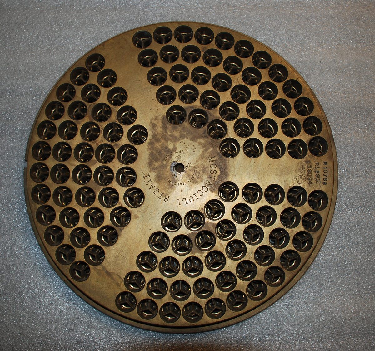 The stamp on this pasta die from the Vimco Pasta factory reads “Mostaccioli Rigati, Donato Malderi, New York,” identifying it as a die made by Donato Malderi, an Italian immigrant from New York with roots in Bari, Italy. Gift of Rose Viviano Schneider.