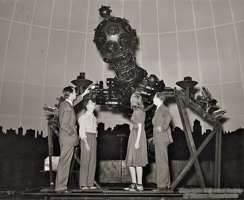 A high school aeronautics class visits the Zeiss II projector.