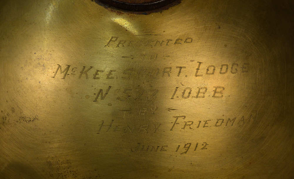 An inscription on the menorah reads, “Presented to McKeesport Lodge No. 573 IOBB by Henry Friedman June 1912.”