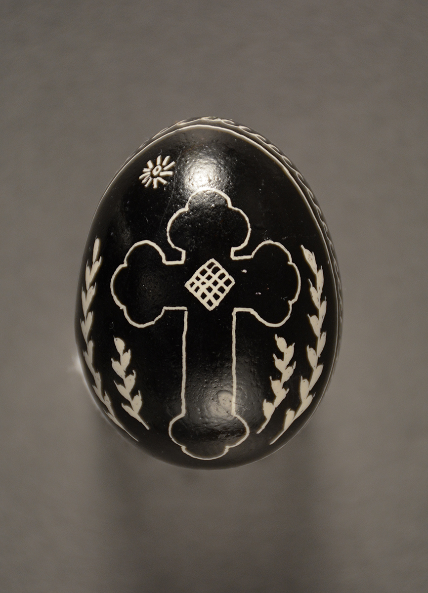 This egg blends traditional religious and natural imagery. Gift of Timo Family.