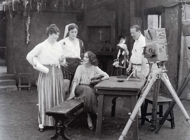 Weber (standing left) and her husband Phillips Smalley (standing right) confer with legendary ballerina Anna Pavlova during the filming of "The Dumb Girl of Portici," her only screen performance (1916).