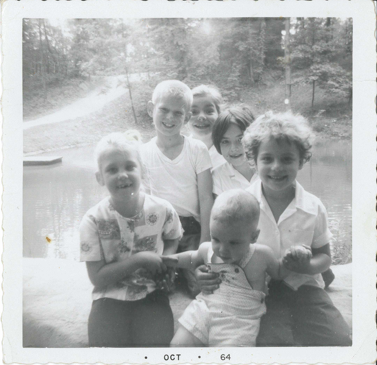 From the back of the photograph: “Taken the last day of school June – 64. Terri and Barry Andrews. Patience, Francie, Erin(?) and Danny at the Pond on Miller Property later Meadowcroft Village.” The blacksmith shop, still there today, would be finished that July on the hill directly across the pond. From the back of the photograph: “Taken the last day of school June – 64. Terri and Barry Andrews. Patience, Francie, Erin(?) and Danny at the Pond on Miller Property later Meadowcroft Village.” The blacksmith shop, still there today, would be finished that July on the hill directly across the pond.