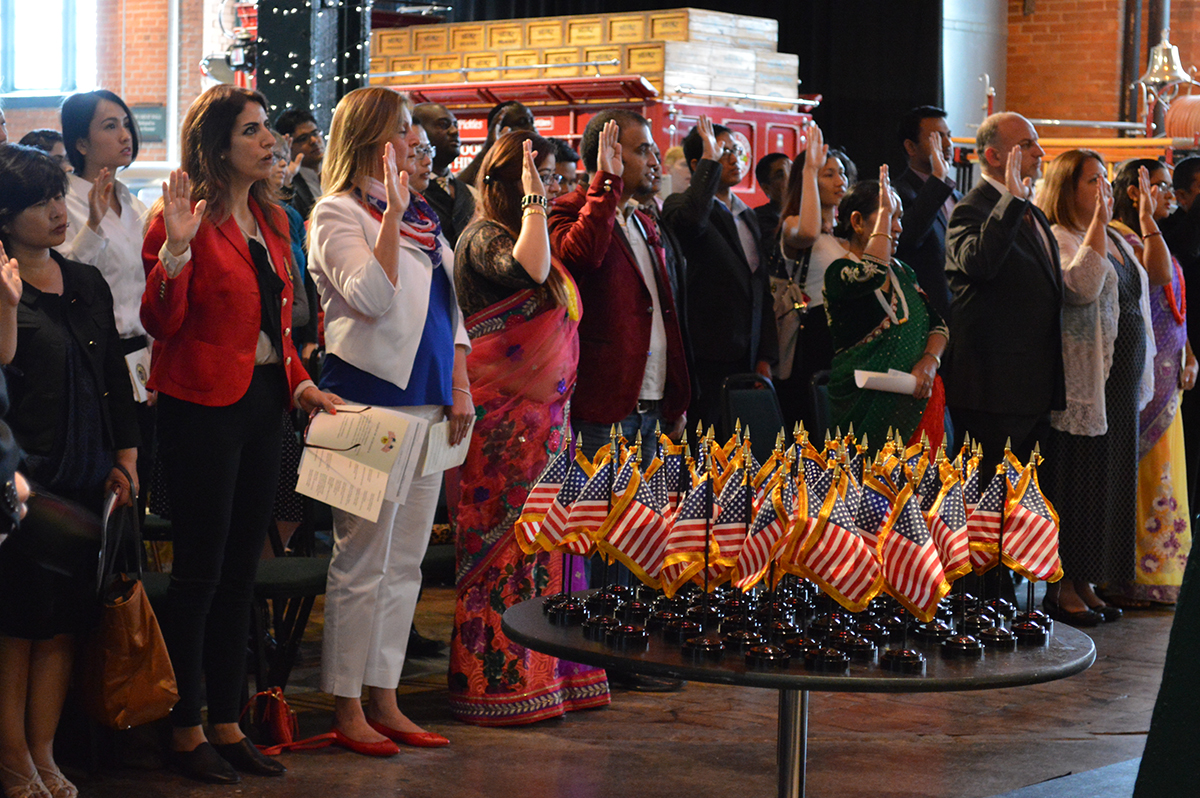 New American citizens are sworn in at a naturalization ceremony at the Senator John Heinz History Center, May 2016.