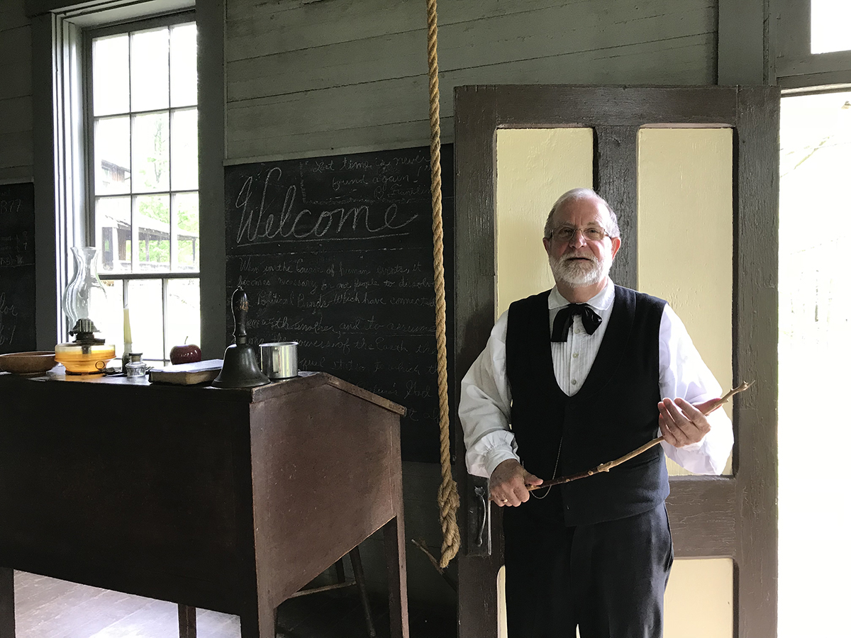 Schoolmaster Gary Ford in the one-room schoolhouse at Meadowcroft Historic Village.