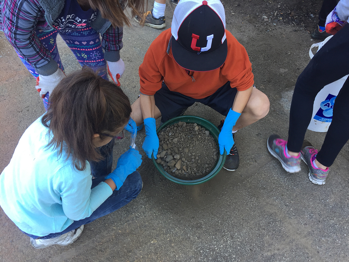 Student sift through dirt in Point State Park during this homeschool class coordinated with both Meadowcroft and the History Center. | Fort Pitt Museum