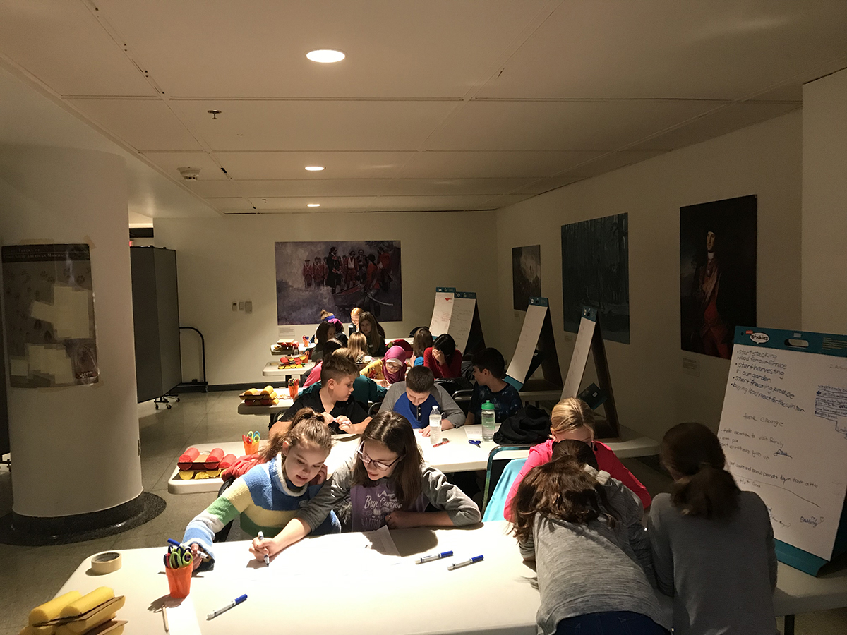 Students reading selections from the Papers of Colonel Henry Bouquet to learn how Fort Pitt, and soldiers in general, prepared for winter. | Fort Pitt Museum