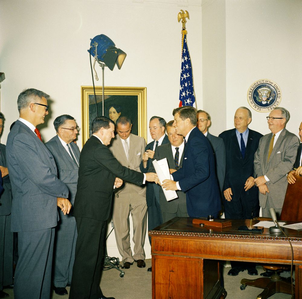 President Kennedy signs National Aeronautics and Space Administration (NASA) Authorizations, July 21, 1961.
