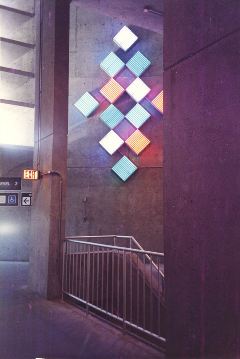 Photograph showing part of Jane Haskell’s Windows of Light, neon installation in the parking garage at Boston Logan International Airport, 1991. Jane Haskell papers, MSS 1046, Rauh Jewish History Program & Archives. Gift of Jane Haskell.