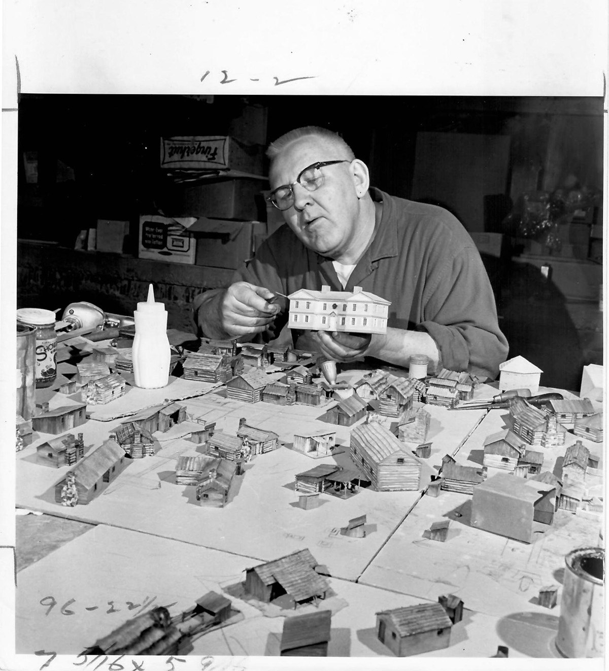 Robert Latta, of Holiday Designs, trims the commandant’s home for the Fort Pitt diorama, June 8, 1969. Copyright © Pittsburgh Post-Gazette, 2019.