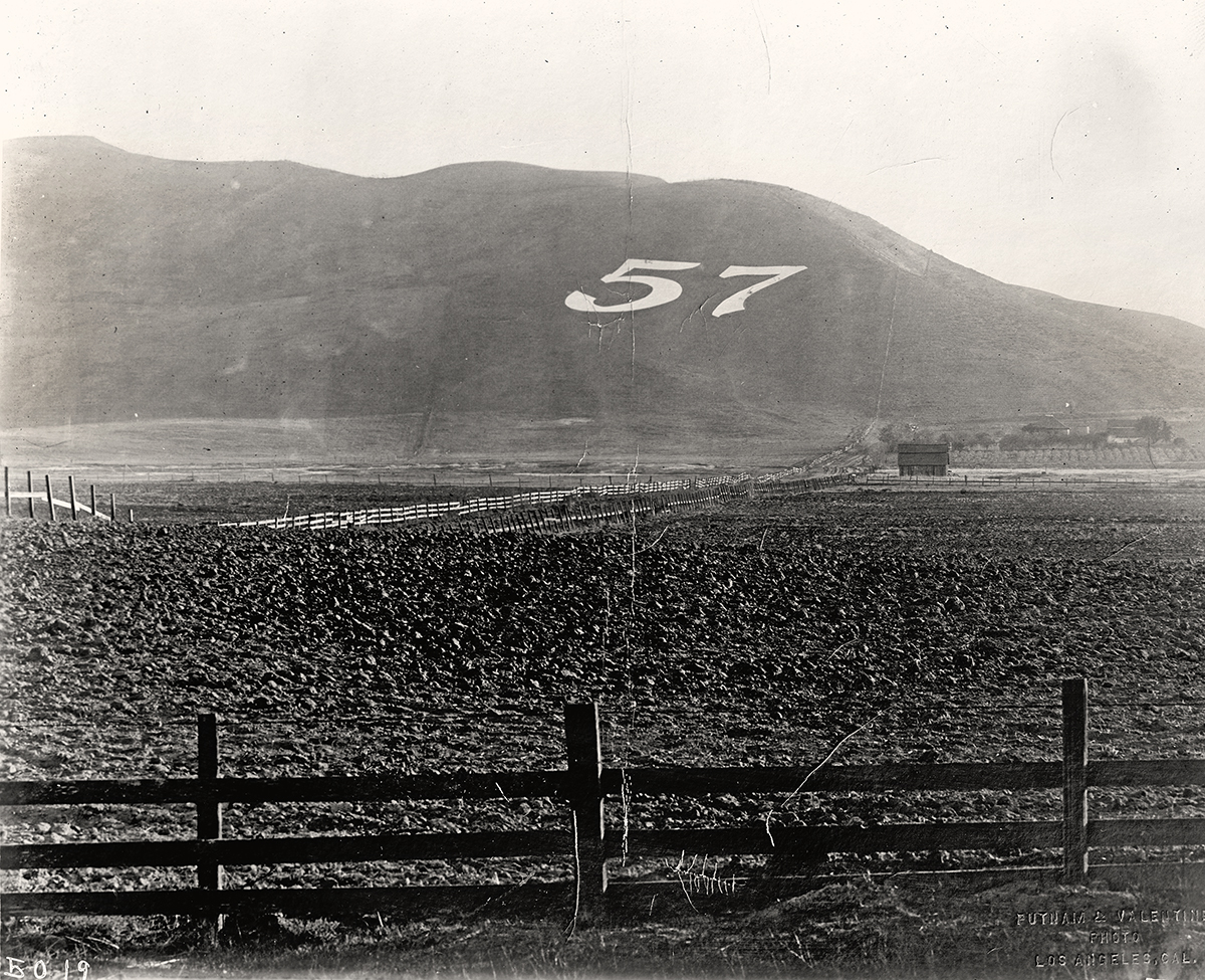 “57” on a hillside, c. 1915.