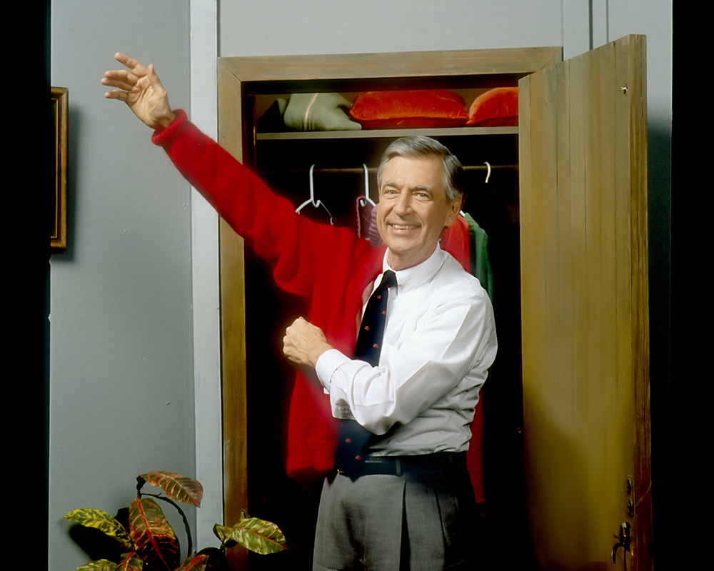 Fred Rogers puts on his iconic red cardigan during an episode of “Mister Rogers’ Neighborhood.” (Image courtesy of Fred Rogers Productions.)