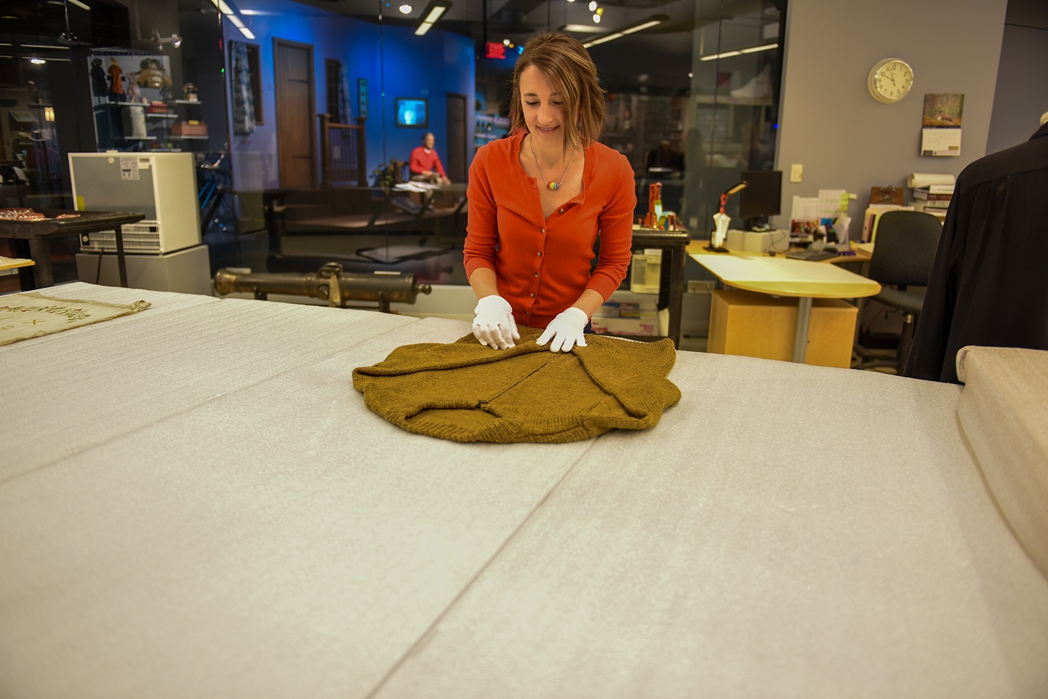 Heinz History Center curator Emily Ruby prepares a handmade sweater owned by Fred Rogers to be added to the museum’s popular “Mister Rogers’ Neighborhood” exhibit.