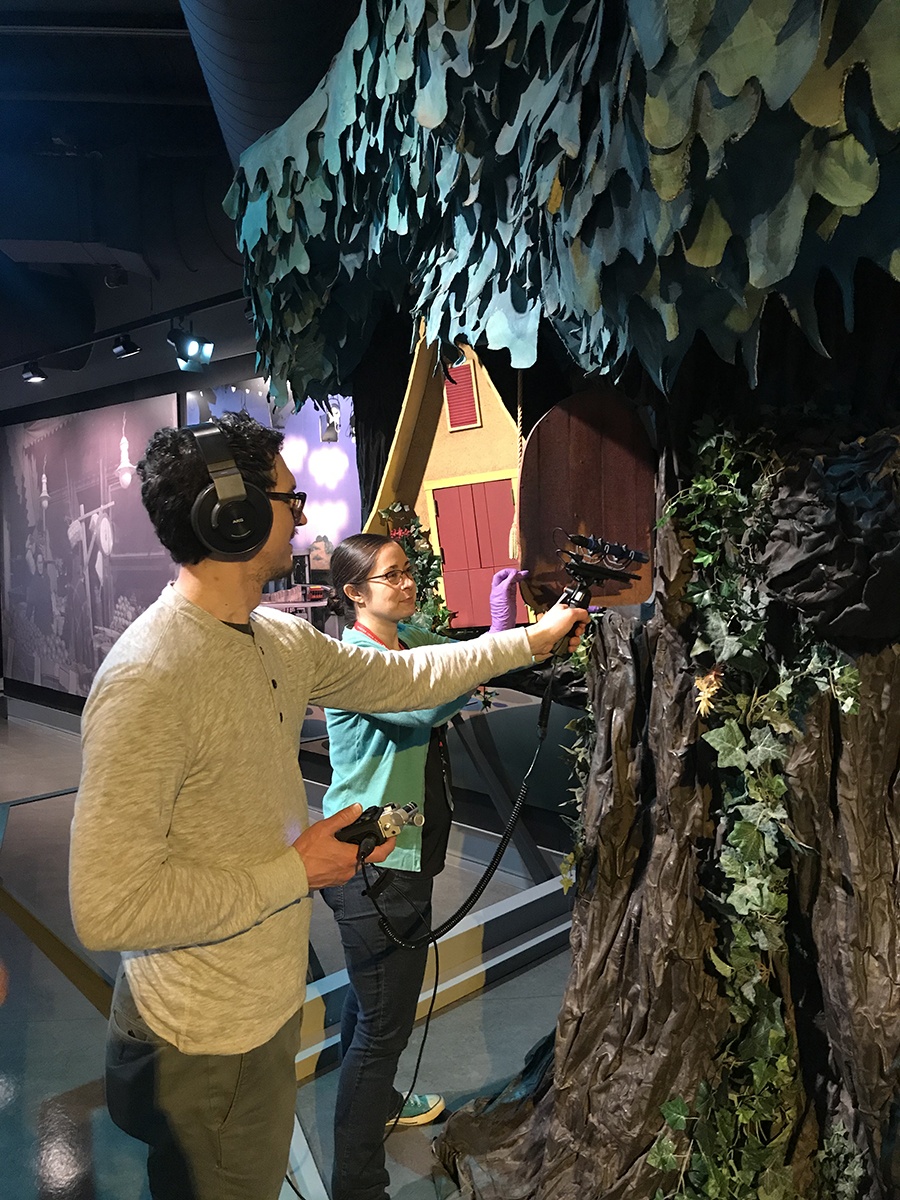 History Center registrar Nicole Lauletta assists an “A Beautiful Day in the Neighborhood” crew member, who records the sound of the living room door opening and closing. Fred Rogers came through this iconic door at the beginning of each episode of “Mister Rogers’ Neighborhood.”