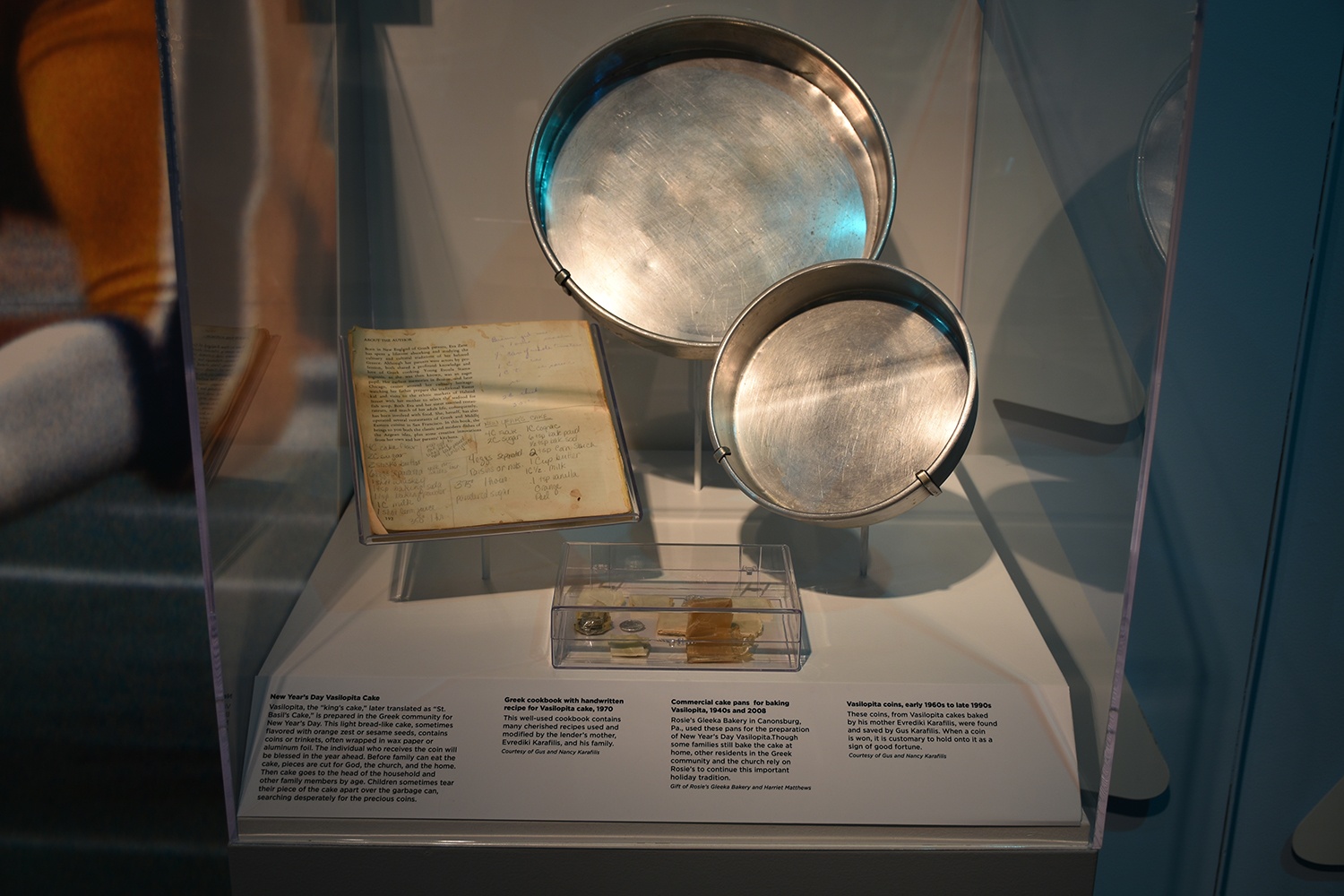 Vasilopita pans and coins on display in A Very Merry Pittsburgh.