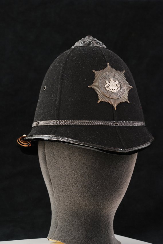 Black police helmet, c. 1906