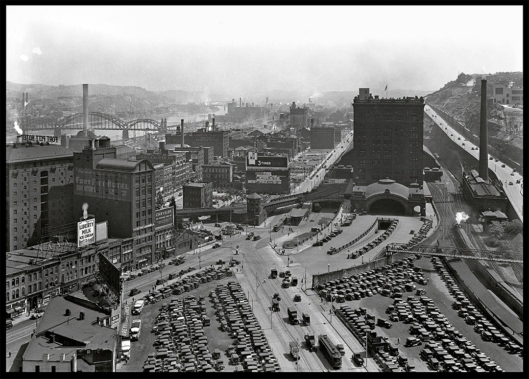 This aerial view from 1930 shows Grant Street at the bottom meeting Liberty Avenue at the Penn Station concourse.