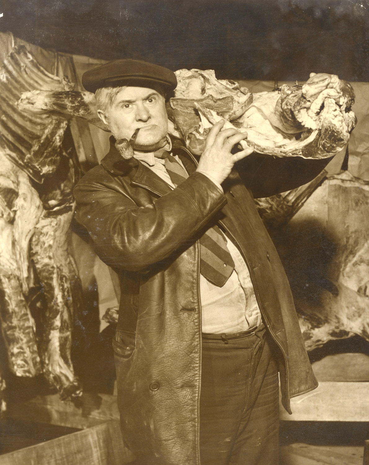 Ray Sprigle poses for a press photo with his black market meat, 1945