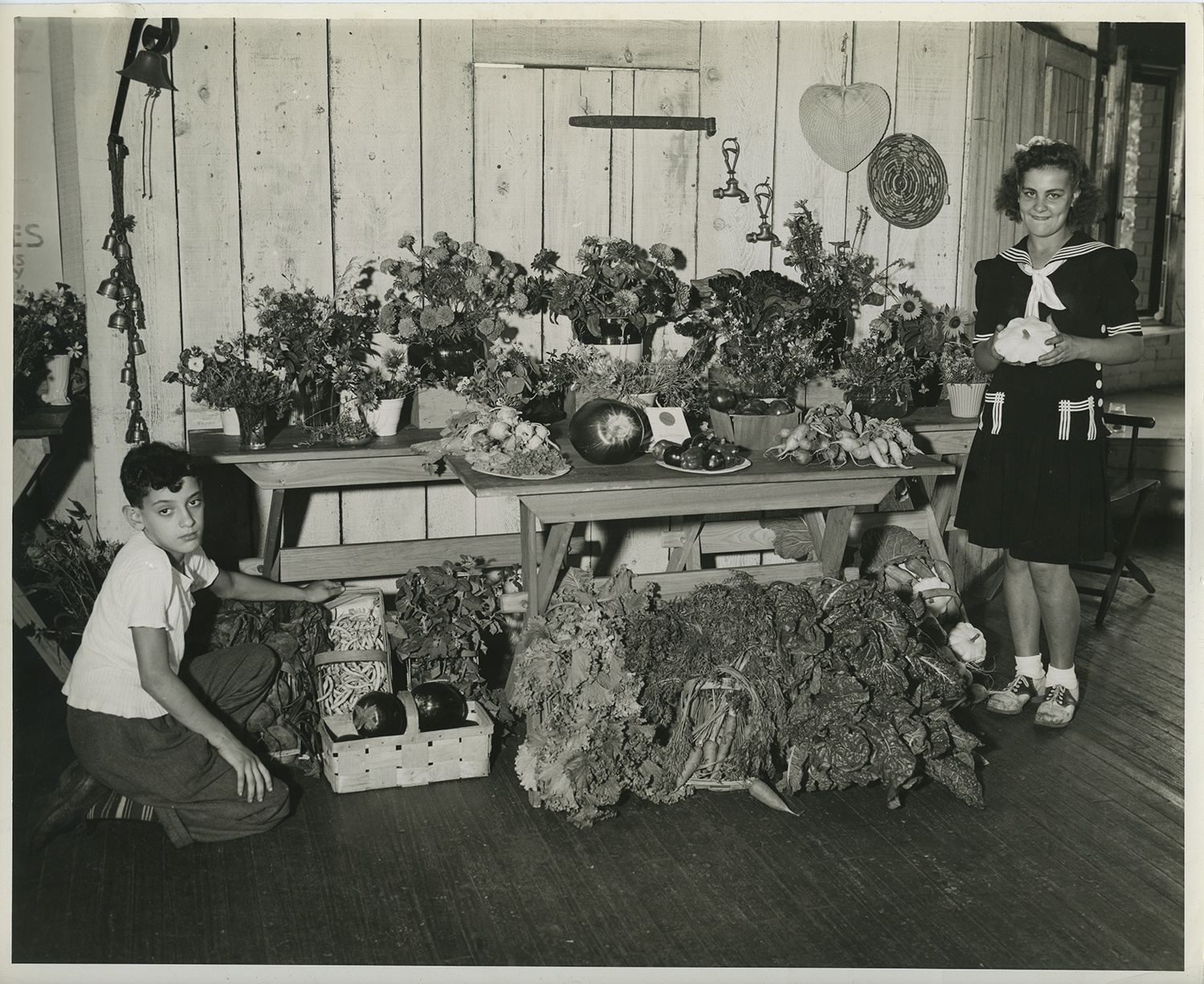 Pittsburgh Public School students pose with the output from one of their gardens, possibly a victory garden, 1940s. Pittsburgh Public School students pose with the output from one of their gardens, possibly a victory garden, 1940s.