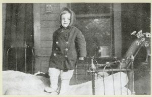 A child on a bed on the porch of the Tuberculosis League of Pittsburgh’s Hospital, c. 1910.