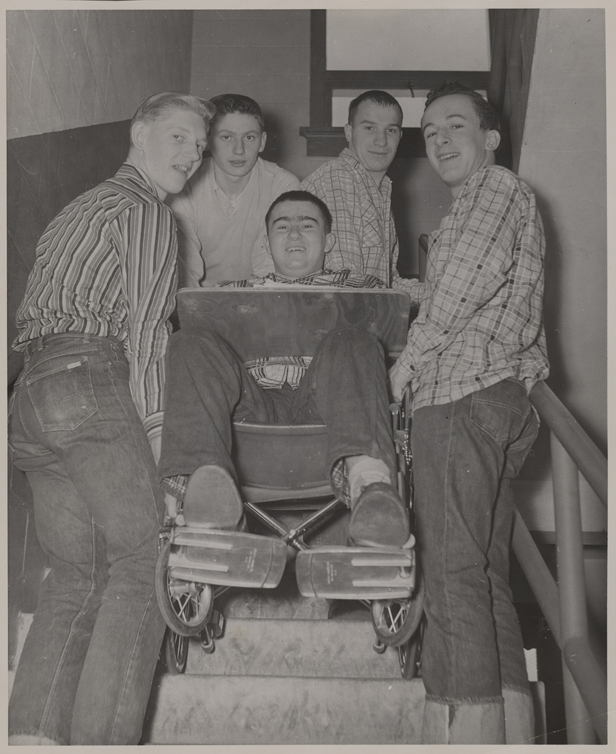 Paul being transported up a flight of stairs by four of his classmates while in high school in 1958. Holly and Paul Dick Family Papers and Photographs, MSS 1177, Detre Library & Archives at the History Center.