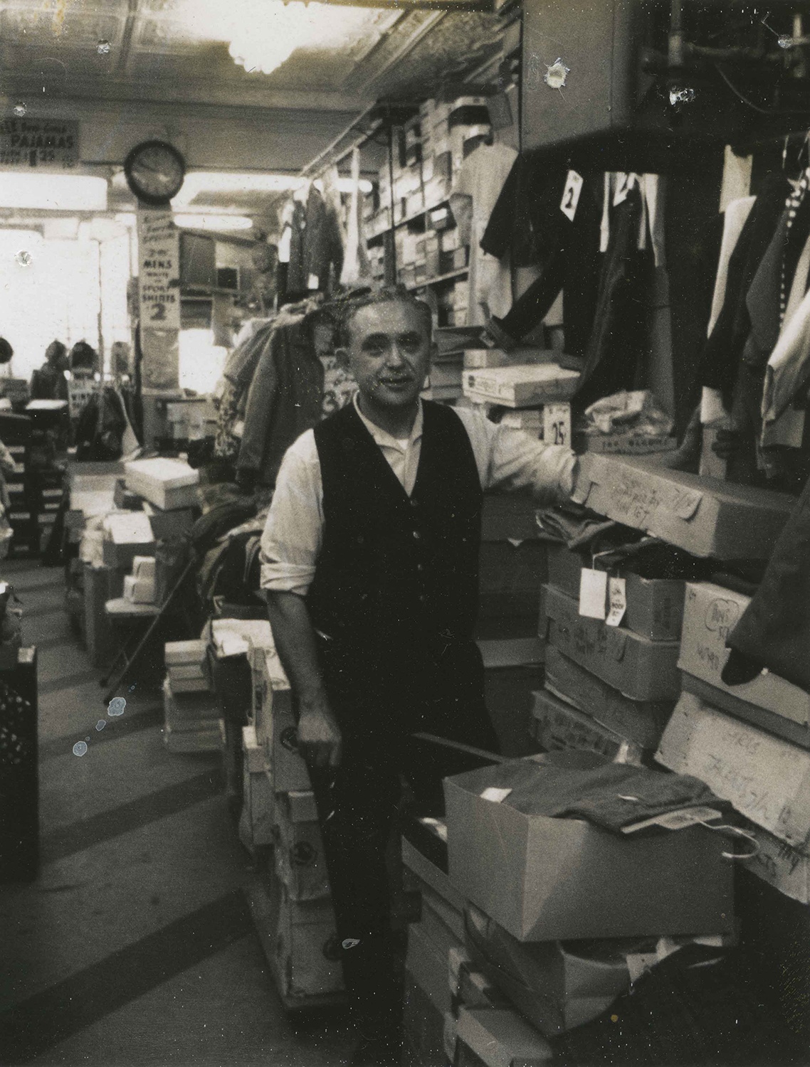 Lawrence Reznik pausing from his work at the Fifth Avenue location of Sam Reznik & Sons. The store moved to Fifth Avenue in the 1950s, after the original Logan Street was demolished during the redevelopment of the Lower Hill. Courtesy of Rochelle Blumenfeld.