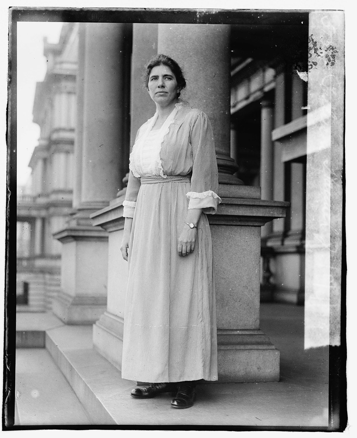 Hannah J. Patterson, appointed temporary assistant to Secretary of War Newton Baker, standing in front of the State, War and Navy Building, Washington, D.C. 1919. Courtesy of the Library of Congress, Prints and Photographs Division.