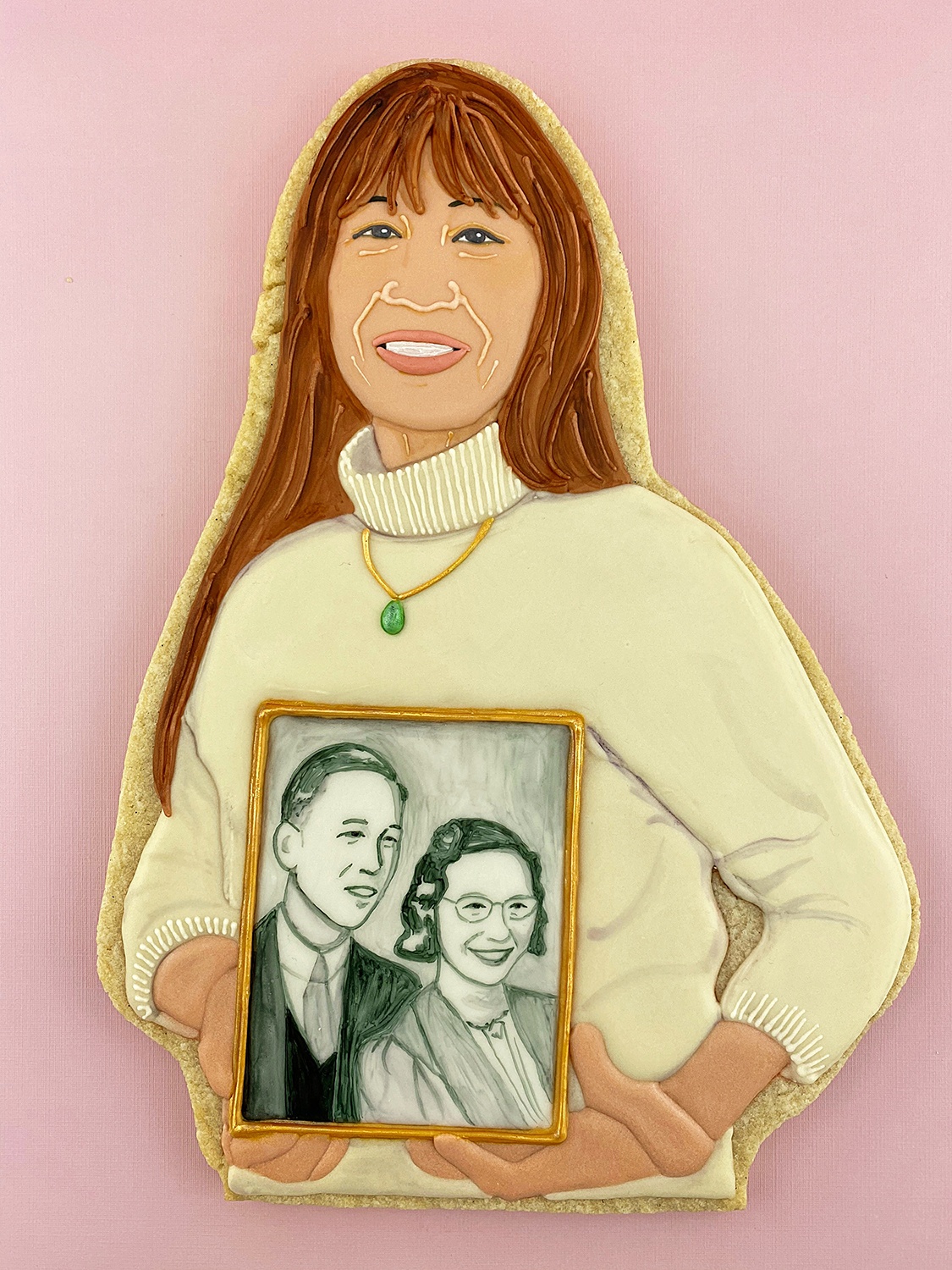 Karen Fung Yee holding a portrait of her parents, by Jasmine Cho, 2020. ©Jasmine Cho