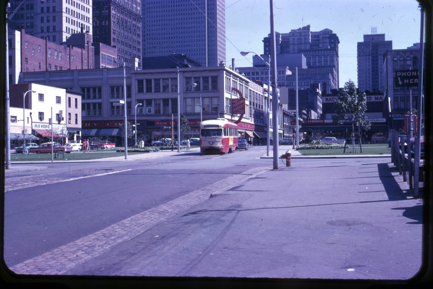 A streetcar runs on Forbes Avenue through Market Square Park, 1962.