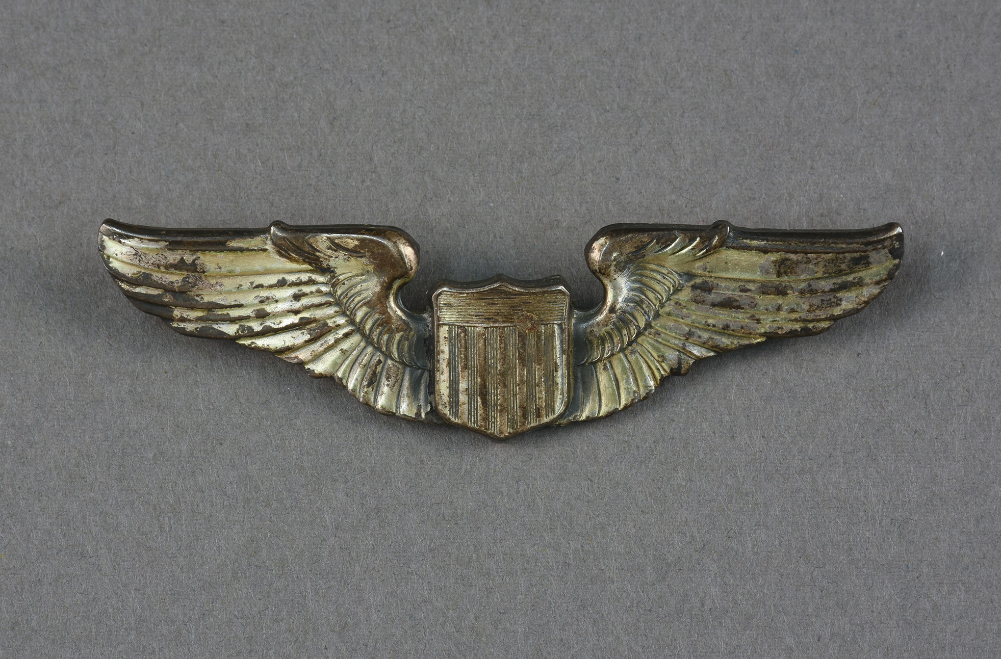 Metal wings for Tuskegee Airmen uniform. Gift of Tuskegee Airmen Memorial.