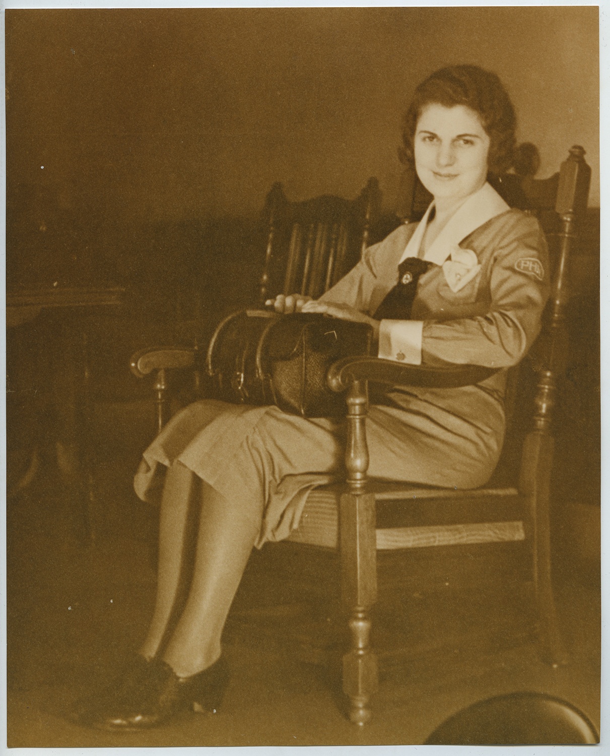 Anne M. Nixon sits with her visiting nurse’s bag, 1930s. Gift of Anne M. Nixon, 1995.0049, Heinz History Center Museum Collections.