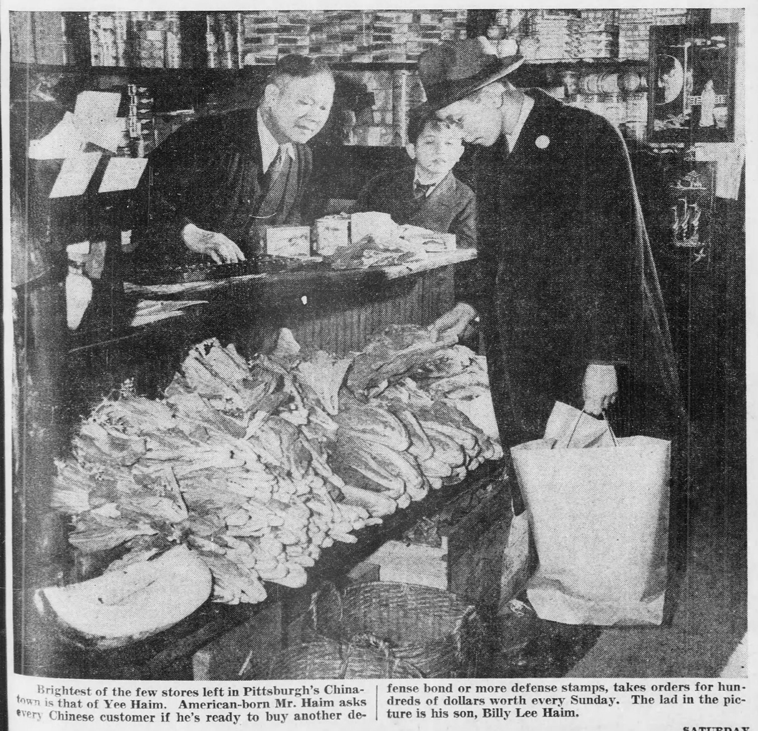 Yee Haim asking customers to buy war bonds in his Chinatown store, 1942. The Pittsburgh Post-Gazette, May 2, 1942.