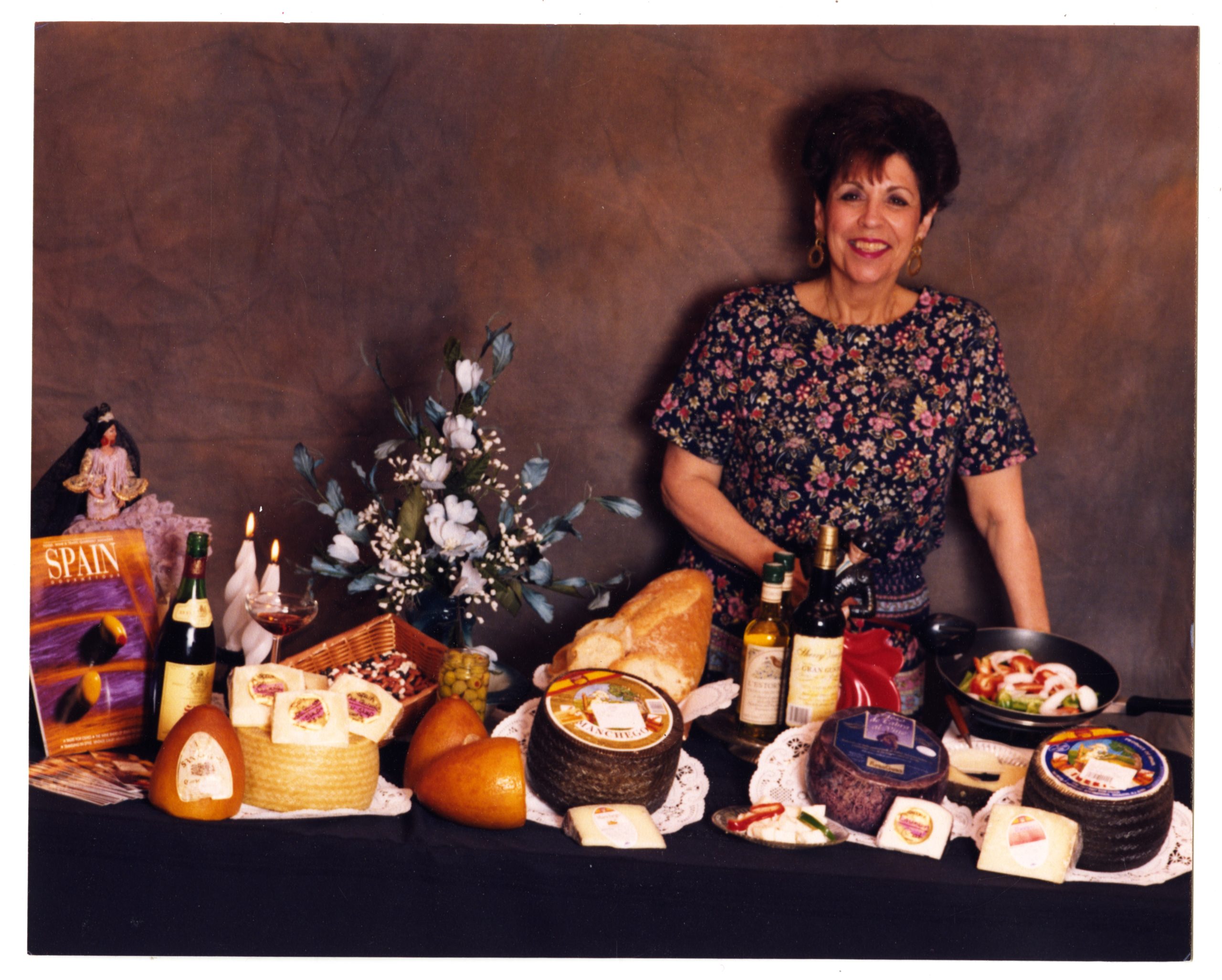 Store employee Raye Coffey preparing gourmet food for a promotional photo shoot, 1990s.