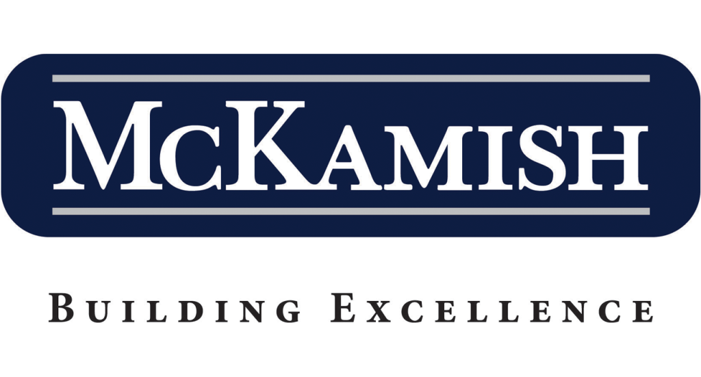 McKamish logo with “McKamish” in bold white capital letters on a dark blue rectangular background; below, the tagline “BUILDING EXCELLENCE” appears in smaller black capital letters.
