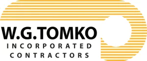Logo for W.G. Tomko Incorporated Contractors; the company name appears in bold black text above horizontal gold lines that curve into a semi-circular shape on the right side, resembling the layout of a bocce court.