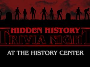 Silhouettes of zombies and gravestones under a red sky. Text: Hidden History Trivia Night at the History Center in bold letters. *AI generated alt text