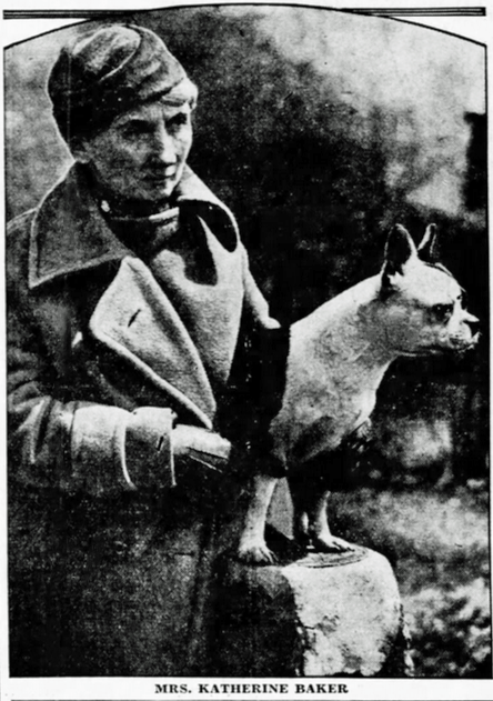 A woman in a coat and hat stands outside next to a dog on a stone pedestal. The caption reads, Mrs. Katherine Baker. *AI generated alt text