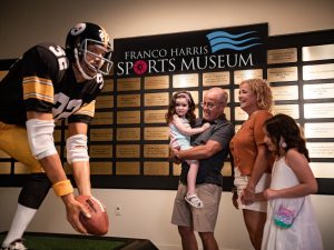 A statue of a football player in the Franco Harris Sports Museum.