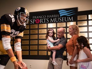 A statue of a football player in the Franco Harris Sports Museum.