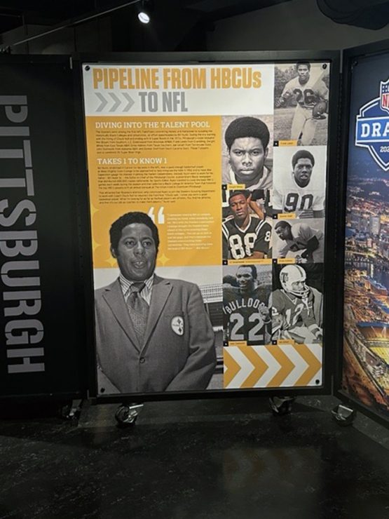 Exhibit panels display Pittsburgh football history, NFL Draft info, HBCU players, local athletes, city photos, and sports moments. *AI generated alt text
